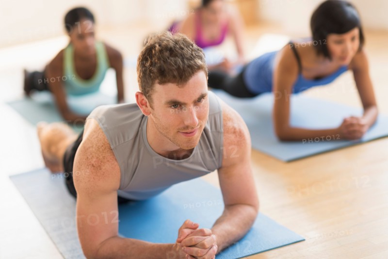 People training in gym.