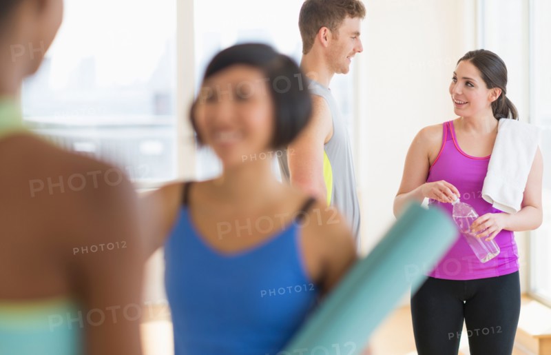 People talking in gym.