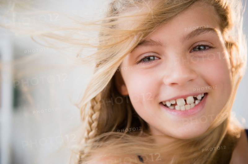 Portrait of smiling blonde girl (8-9)