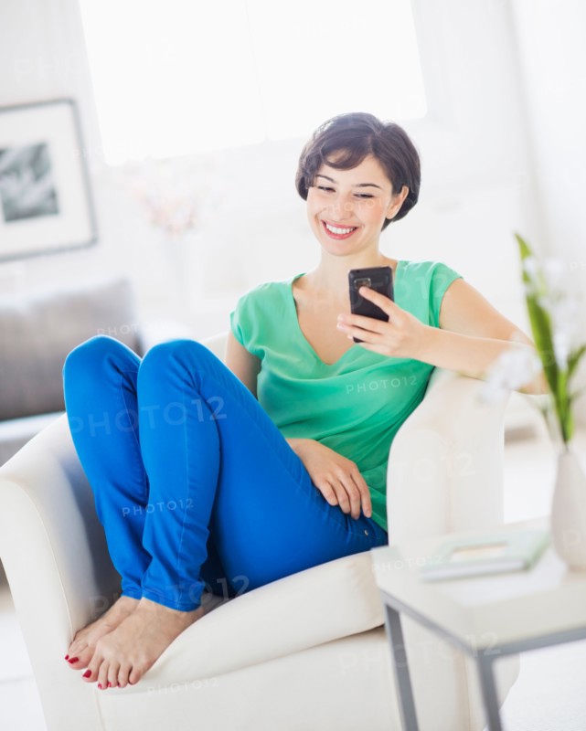 Portrait of young woman using mobile phone