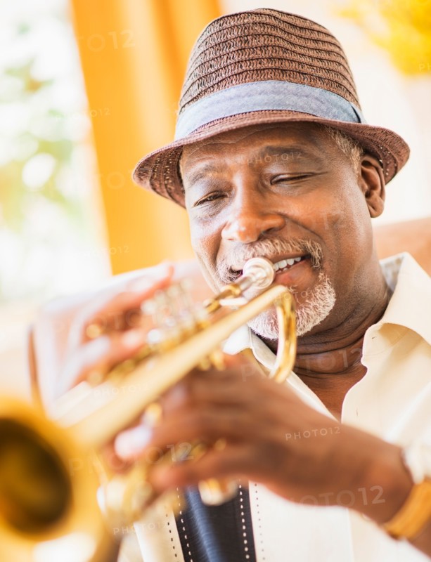 Portrait of man playing trumpet