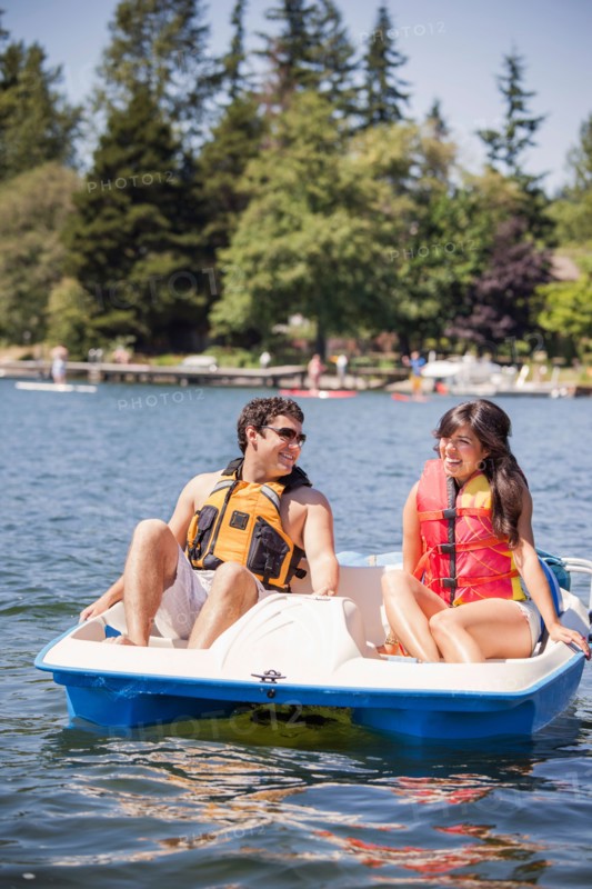 Young man and woman on paddle boat