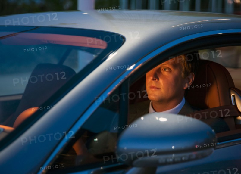 Businessman driving car