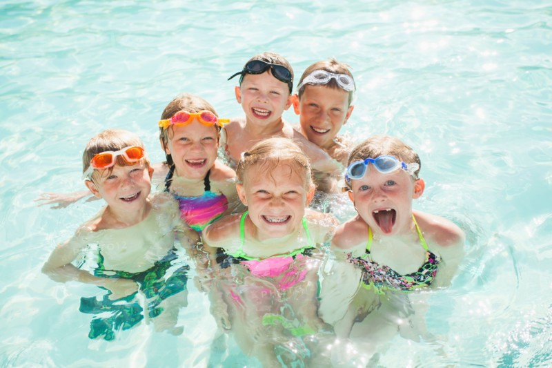Children (4-5, 2-3, 8-9, 10-11, 18-23 months) playing in swimming pool