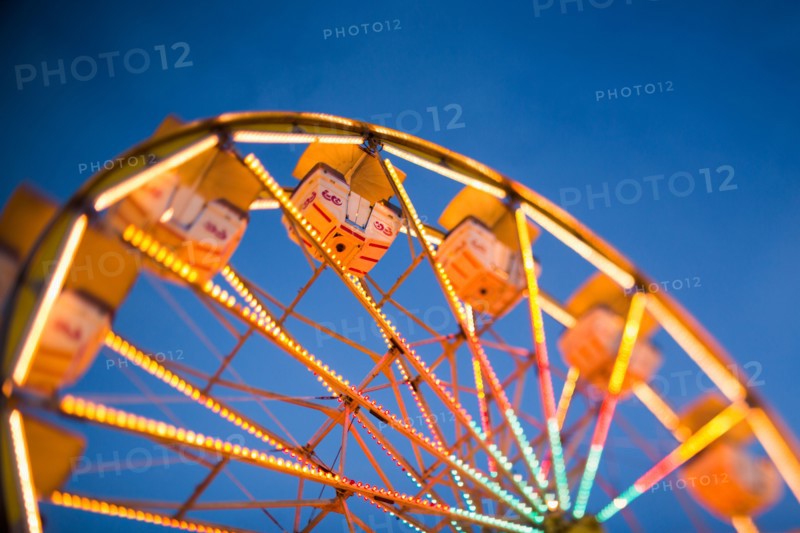 Ferris wheel in amusement park at dusk