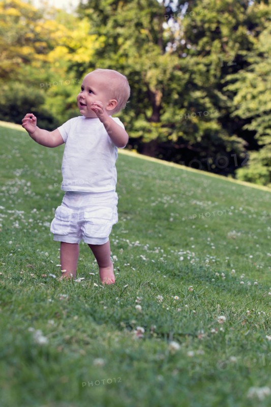 Baby (12-17 months) playing in park
