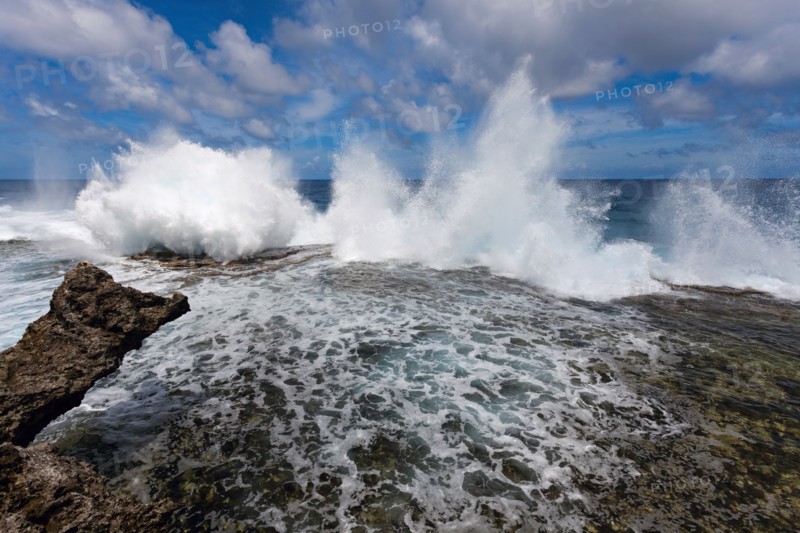 Wave crushing on rock