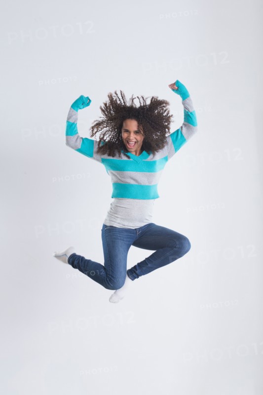 Studio Shot of girl (12-13) jumping