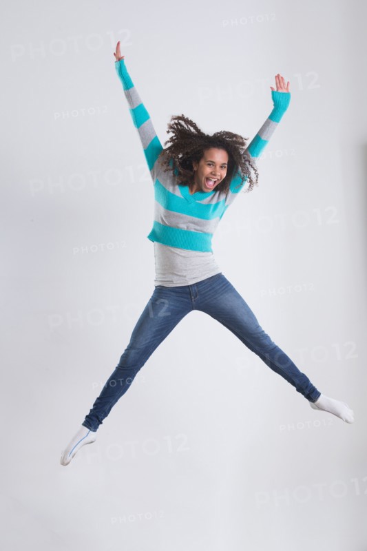 Studio Shot of girl (12-13) jumping