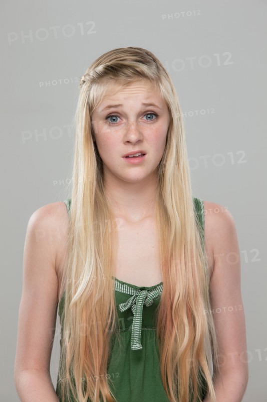 Portrait of teenage girl (14-15) making a face