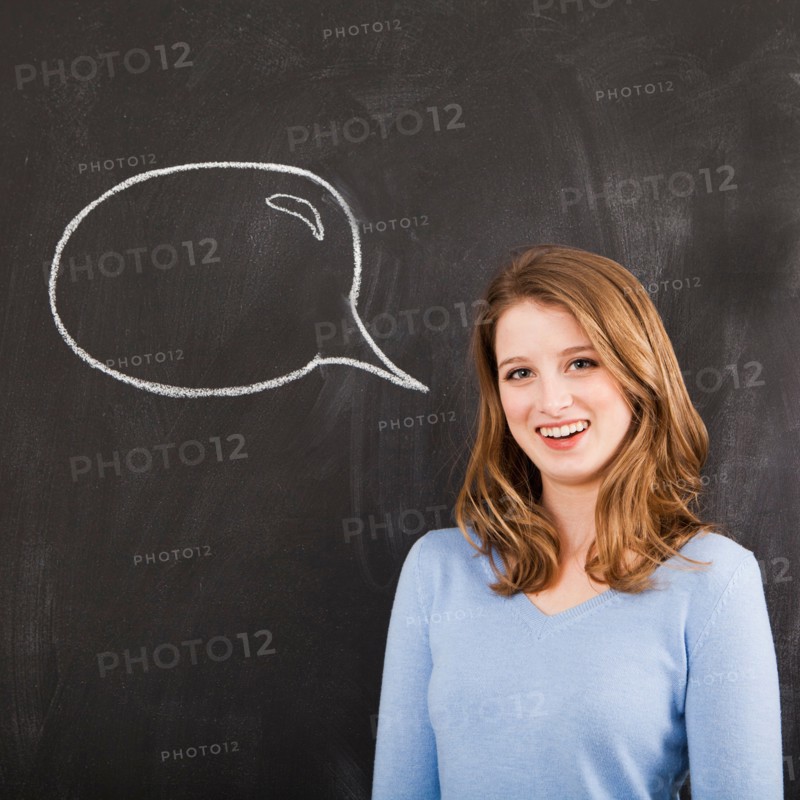 Studio portrait of woman with chalk speech bubble