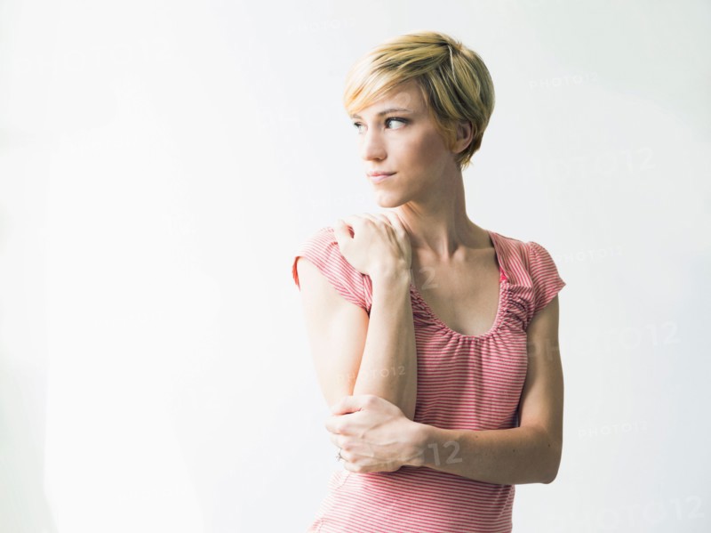 Young woman looking away, studio shot