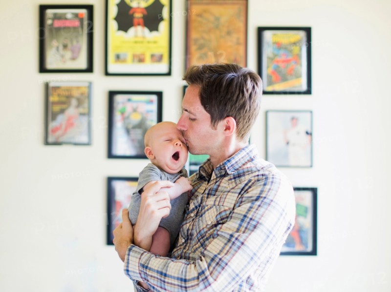 Father kissing baby son (2-5 months)