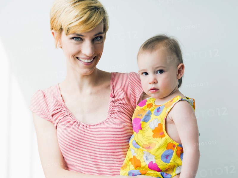 Portrait of mother holding daughter (12-17 months)