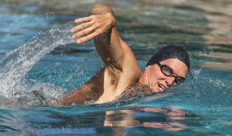 Athletic man swimming.