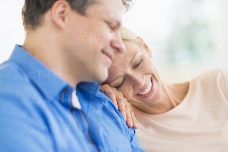 Couple relaxing, focus on woman.