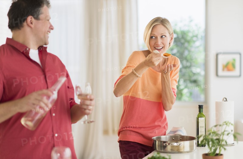 Couple cooking at home.