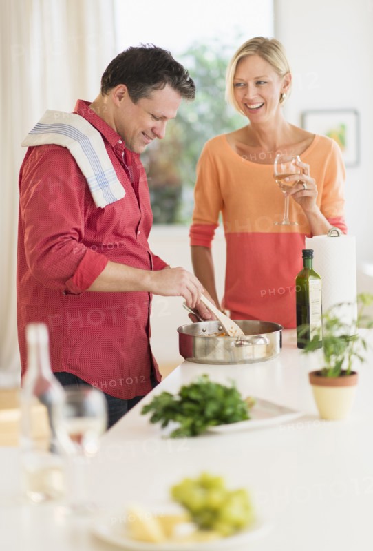 Couple cooking at home.