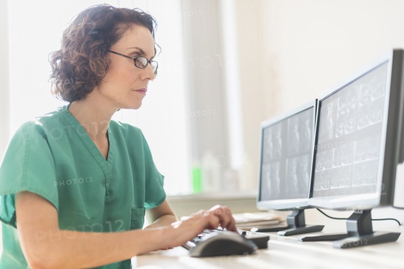Female technician working on computer.