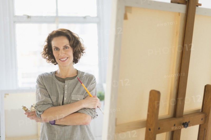 Portrait of female painter in studio.