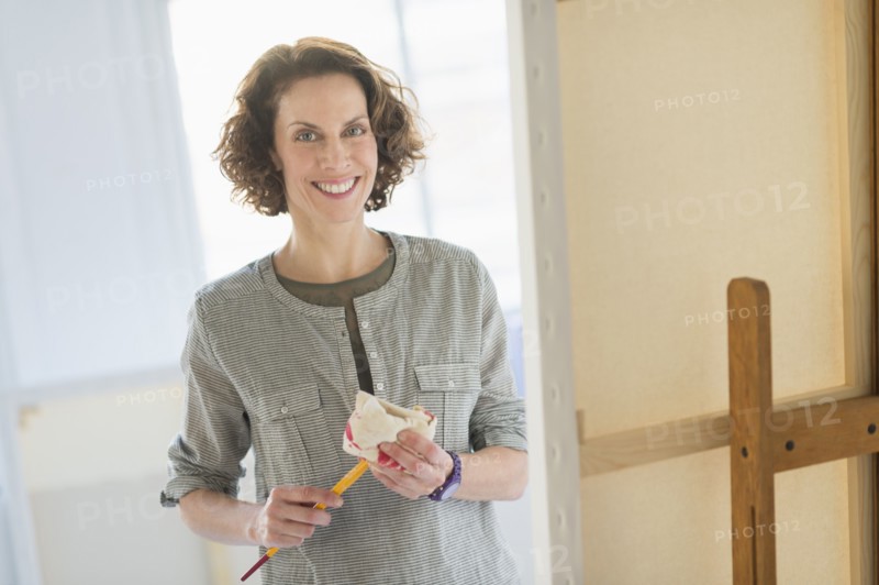 Portrait of artist in studio.