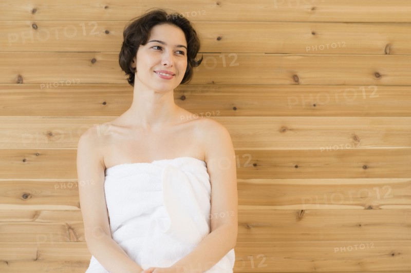 Woman relaxing in sauna.
Photo : Jamie Grill