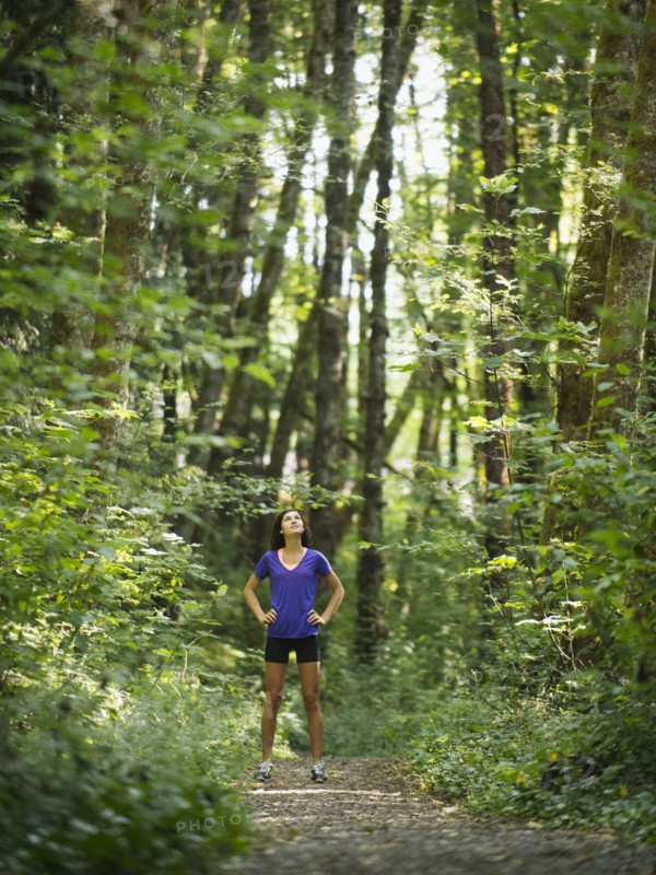 Young women resting in forest. USA, Oregon, Portland.