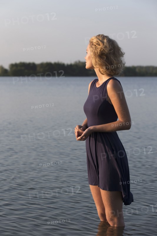 Beautiful woman standing in lake. Netherlands, Gelderland, De Rijkerswoerdse Plassen.
Photo : Jan Scherders