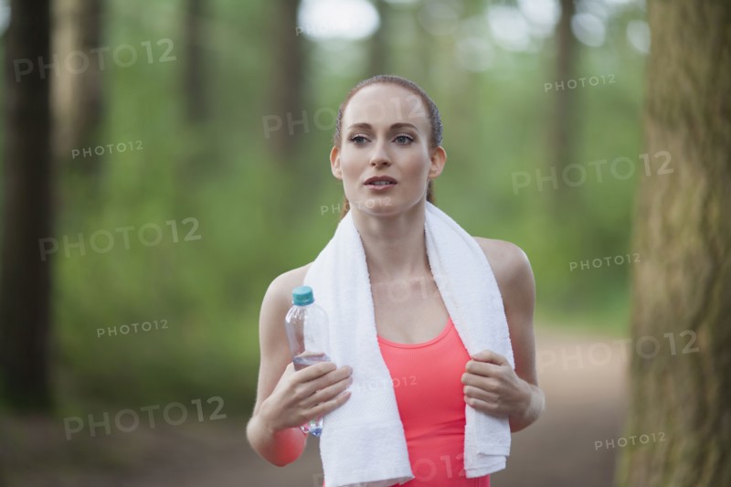 Portrait of woman holding bottle of water. The Netherlands, Erp.
Photo : Mark de Leeuw