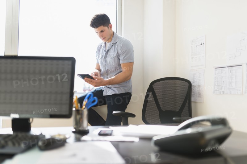 Young man using tablet.