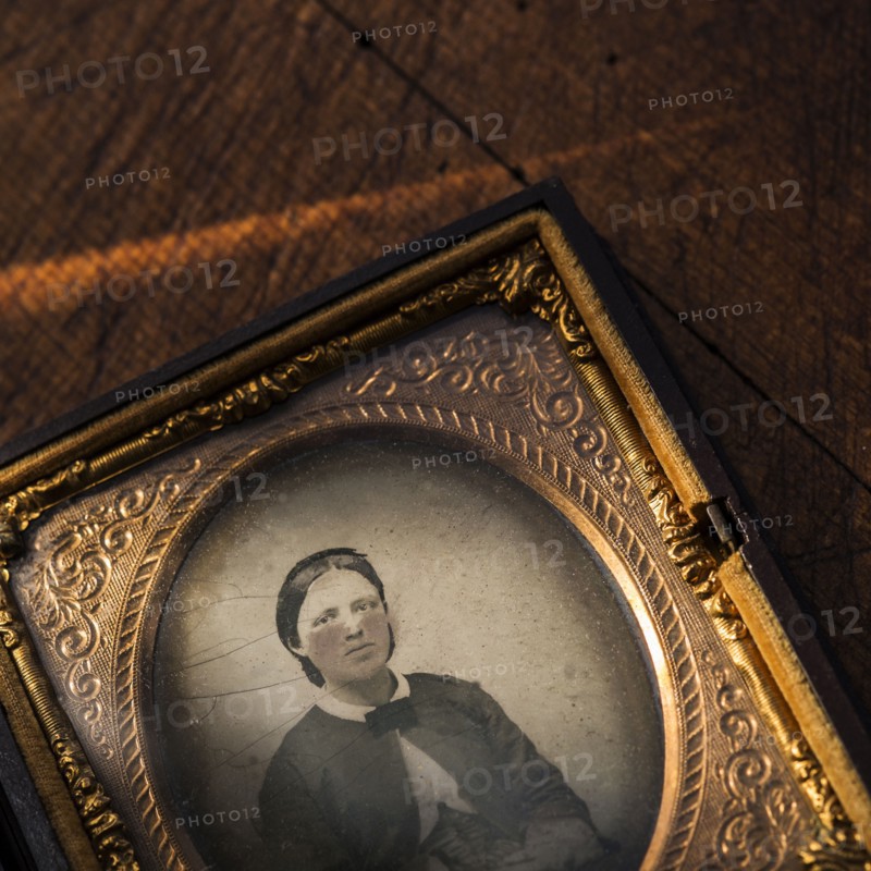 Studio shot of old fashioned photograph in picture frame.