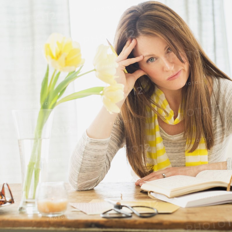 Portrait of woman at desk.