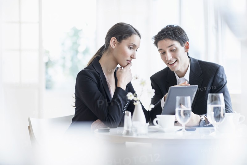 Woman and man at business lunch.