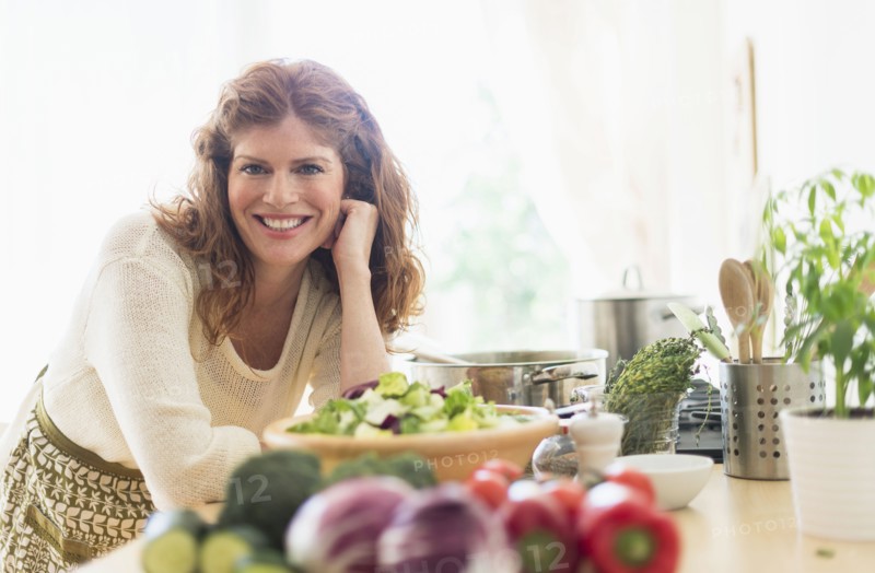Woman cooking in kitchen.