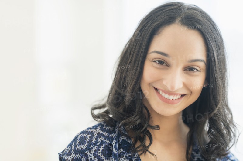 Portrait of smiling young woman .