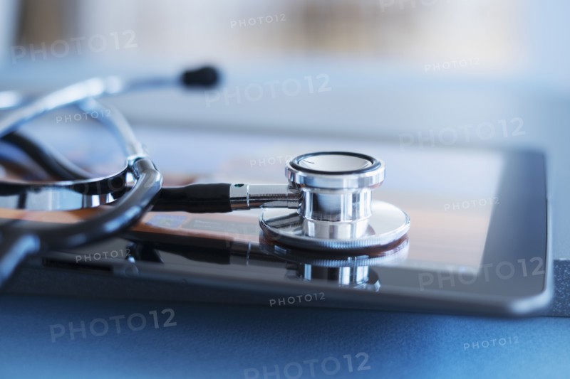 Close up view of stetoscope on digital tablet.