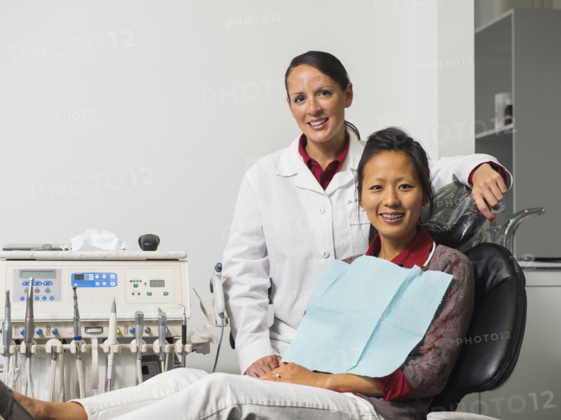 Portrait of dentist with patient.