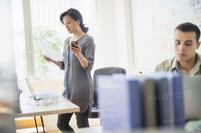 Couple working in office.