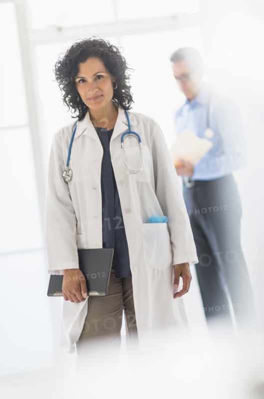 Female and male doctors in hospital.