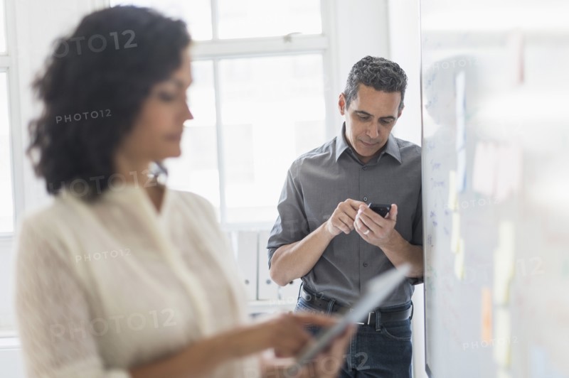 Man and woman working in office.