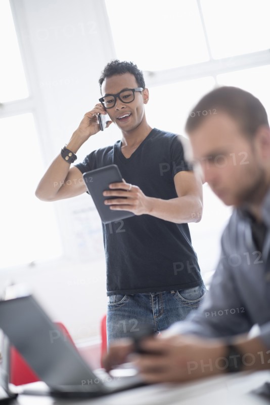 Men working in office.