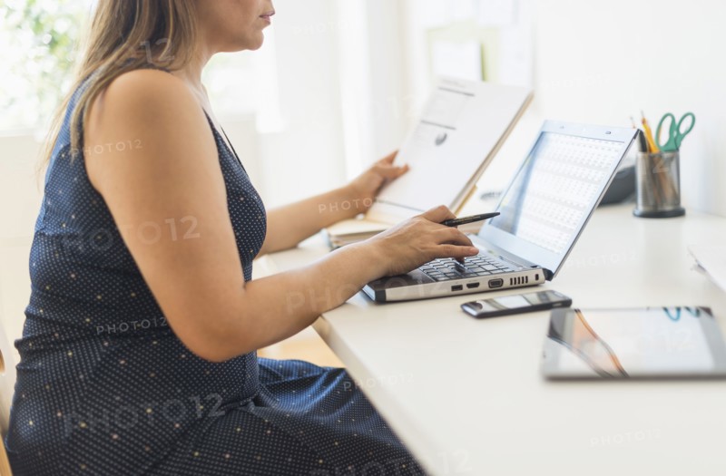 Woman working in home office.