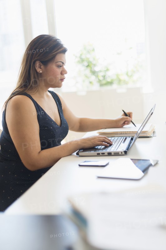 Woman working in home office.