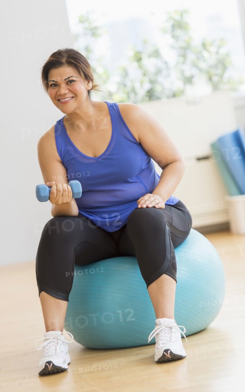 Woman exercising at gym.