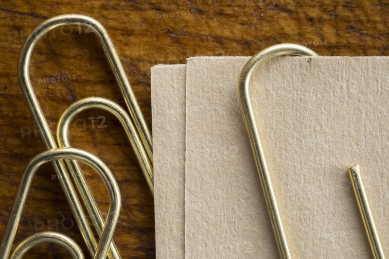 Close up of paper clips and paper.