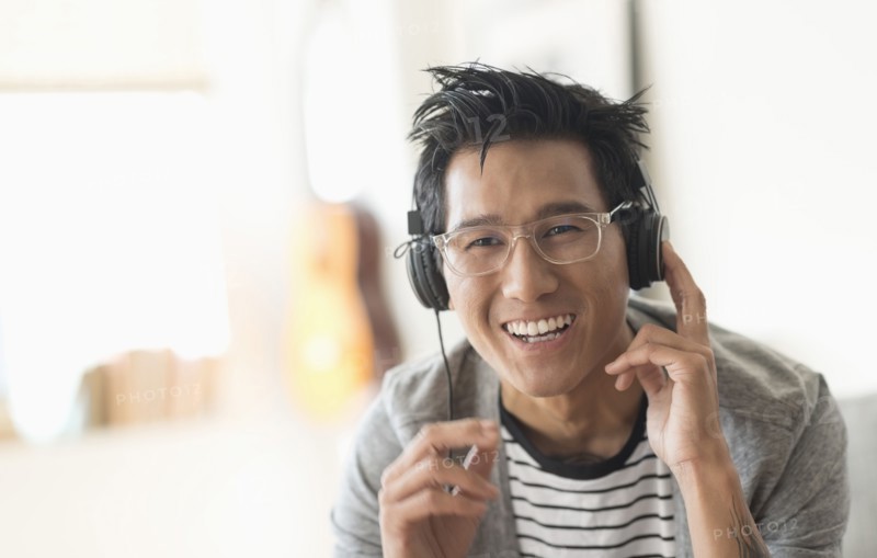 Cheerful man listening to music.