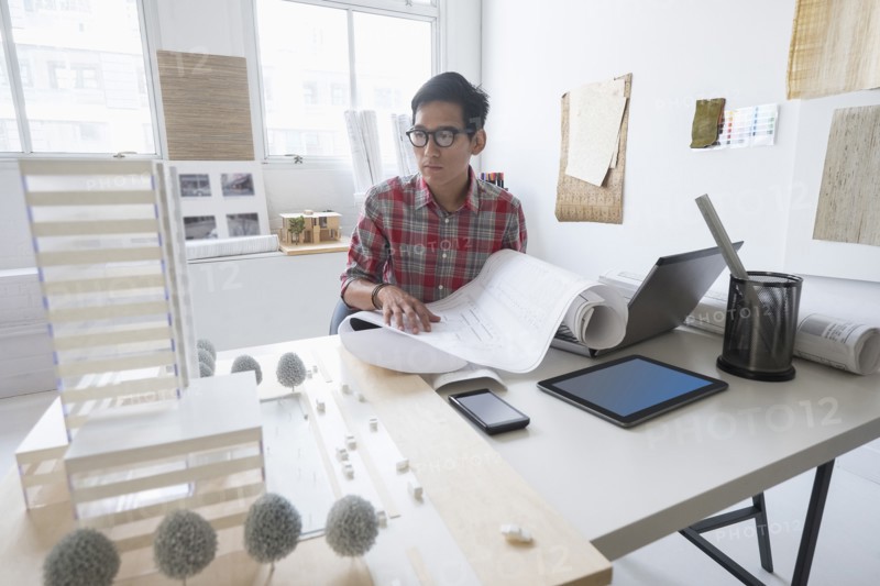 Architect working in office.