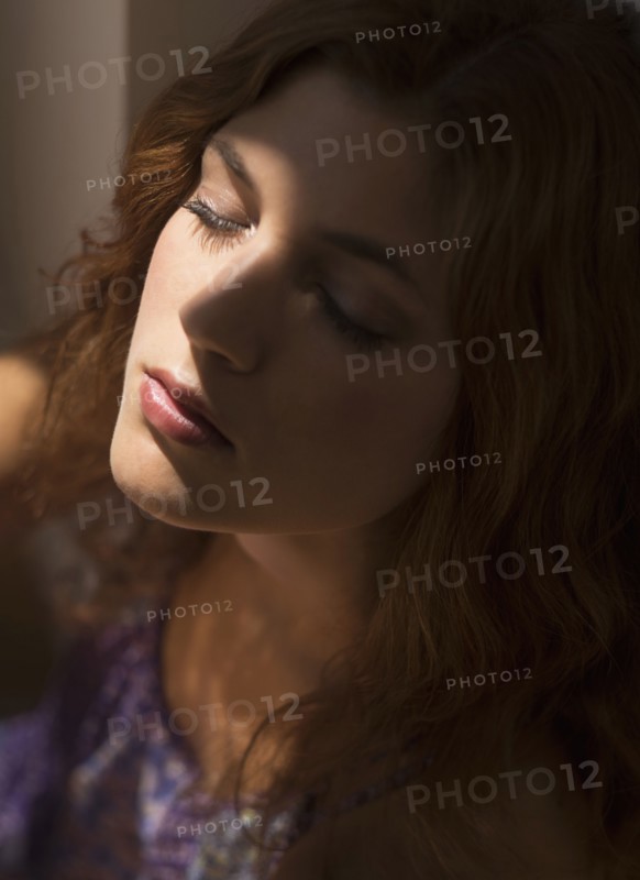 Portrait of beautiful woman with eyes closed.