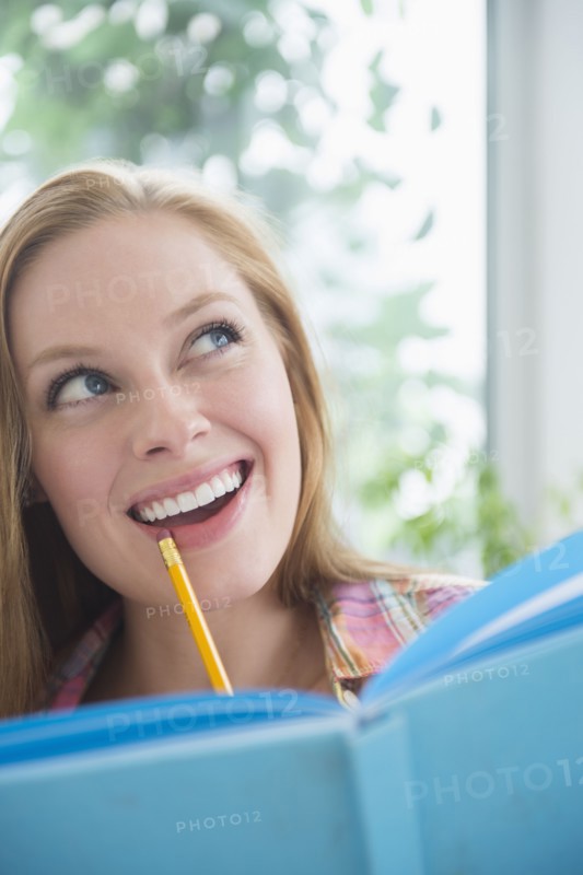 Portrait of young woman planning