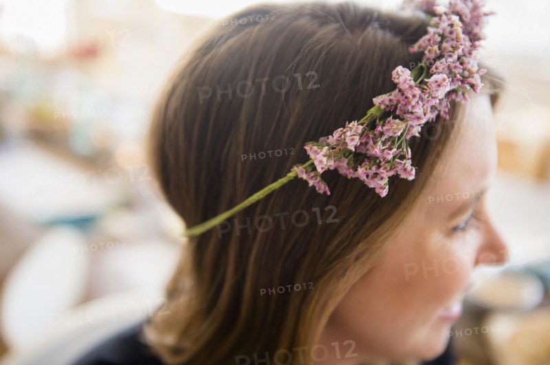 Woman with flowers on head